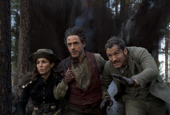 NOOMI RAPACE as Sim, ROBERT DOWNEY JR. as Sherlock Holmes and JUDE LAW as Dr. Watson in Warner Bros. PicturesÕ and Village Roadshow PicturesÕ action adventure mystery ÒSHERLOCK HOLMES: A GAME OF SHADOWS,Ó a Warner Bros. Pictures release.Photo by Daniel Smith